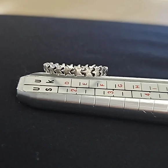 Sterling silver ring with stars all the way around the band. Infinity star band - Picture 2 of 4